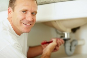 Plumber Fixing A Sink Leak